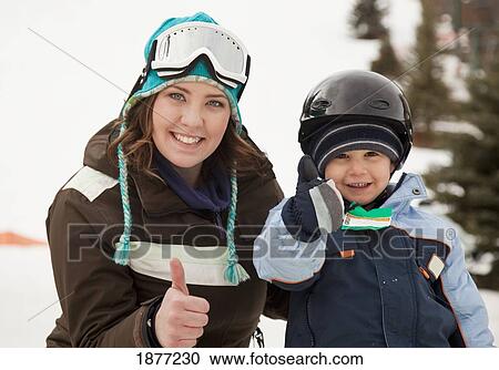 red deer, alberta, canada; a mother with her young son wearing helmets and ski masks giving the 'thumbs up' sign View Large Photo Image Stock Image - red deer, alberta, canada; a mother with her young son wearing helmets and ski masks giving the 'thumbs up' sign. Fotosearch