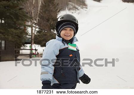 red deer, alberta, canada; a young boy wearing a helmet at a ski hill View Large Photo Image Stock Image - red deer, alberta, canada; a young boy wearing a helmet at a ski hill. Fotosearch
