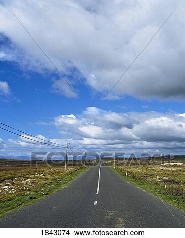 Picture - Road Running Through A Bare Landscape. Fotosearch