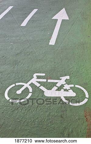 Stock Image - salamanca, spain; stencil of bicycle and arrows on a cycling track. Fotosearch