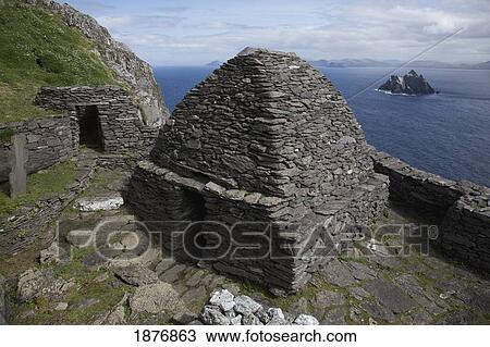 Stock Image - skellig michael, county kerry, ireland; view of skellig beag behind 'beehive' monk huts (clochans). Fotosearch