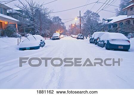 Stock Image - snow covering a residential street (se 35th avenue); portland, oregon, united states of america. Fotosearch