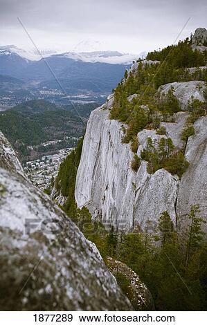 Stock Photo - squamish, british columbia, canada; the peaks of the stawamus chief, a rock climbing destination. Fotosearch