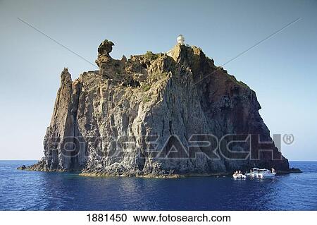 Stock Image - strombolicchio lighthouse; stromboli, sicily, italy. Fotosearch
