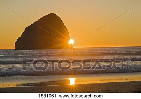sunburst and haystack rock at cape kiwanda; pacific city, oregon, united states of america View Large Photo Image Stock Image - sunburst and haystack rock at cape kiwanda; pacific city, oregon, united states of america. Fotosearch
