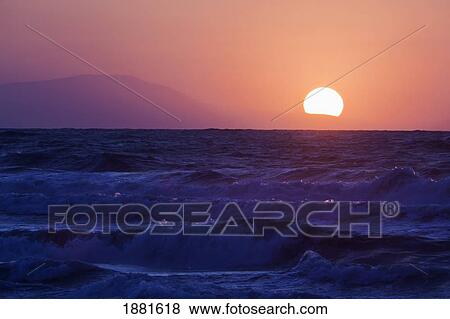 Stock Photo - sunrise over the malaga bay; torremolinos, malaga, andalusia, spain. Fotosearch