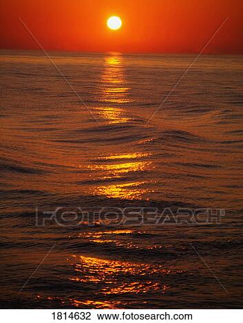 Stock Image - Sunset Over The Sea. Fotosearch