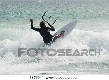 Stock Image - tarifa, cadiz, andalusia, spain; a man kitesurfing at punta paloma beach. Fotosearch