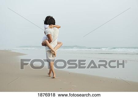 tarifa, cadiz, andalusia, spain; a couple walking on the sand at los lances beach along costa de la luz View Large Photo Image Stock Photo - tarifa, cadiz, andalusia, spain; a couple walking on the sand at los lances beach along costa de la luz. Fotosearch