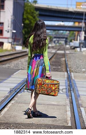 teenage girl on the train tracks downtown; portland, oregon, united states of america View Large Photo Image Picture - teenage girl on the train tracks downtown; portland, oregon, united states of america. Fotosearch