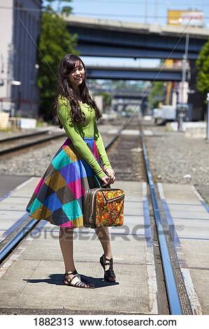 teenage girl on the train tracks downtown; portland, oregon, united states of america View Large Photo Image Stock Image - teenage girl on the train tracks downtown; portland, oregon, united states of america. Fotosearch