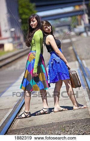 teenage girls standing on the train tracks downtown; portland, oregon, united states of america View Large Photo Image Stock Photo - teenage girls standing on the train tracks downtown; portland, oregon, united states of america. Fotosearch