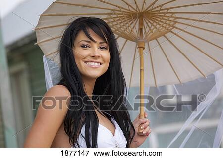 three hills, alberta, canada; a bride with a parasol View Large Photo Image Stock Photo - three hills, alberta, canada; a bride with a parasol. Fotosearch