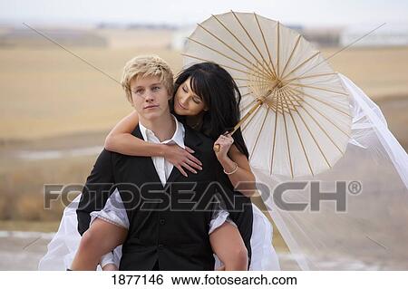 three hills, alberta, canada; a bride and groom in rural alberta View Large Photo Image Stock Photograph - three hills, alberta, canada; a bride and groom in rural alberta. Fotosearch