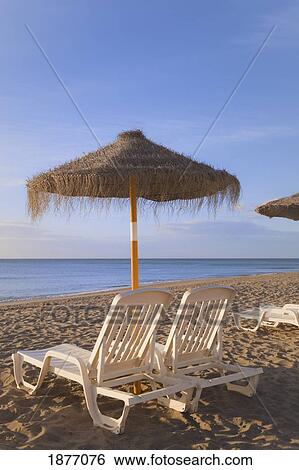 torremolinos, malaga, andalusia, spain; sun umbrellas and beach beds on a beach in costa del sol View Large Photo Image Stock Photograph - torremolinos, malaga, andalusia, spain; sun umbrellas and beach beds on a beach in costa del sol. Fotosearch
