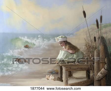 Picture - victoria, british columbia, canada; a girl posed by the seashore. Fotosearch