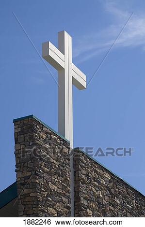 white cross on top of a stone church wall; crossfield, alberta, canada View Large Photo Image Stock Photograph - white cross on top of a stone church wall; crossfield, alberta, canada. Fotosearch