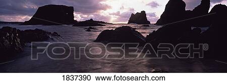Whiterocks, Co Antrim, Ireland; Rocks In The Sea At Sunset View Large Photo Image Stock Image - Whiterocks, Co Antrim, Ireland; Rocks In The Sea At Sunset. Fotosearch