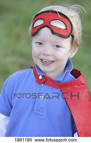 young boy playing outdoors with a mask and cape; portland, oregon, united states of america View Large Photo Image Stock Photography - young boy playing outdoors with a mask and cape; portland, oregon, united states of america. Fotosearch