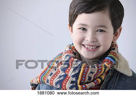 Stock Image - young boy wearing a scarf. Fotosearch