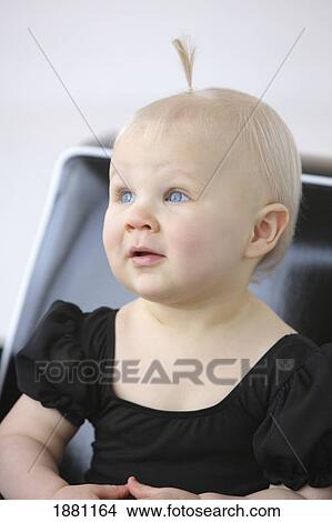 Picture - young girl sitting in a chair; gresham, oregon, united states of america. Fotosearch