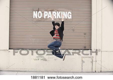 young man having fun by a loading dock; portland, oregon, united states of america View Large Photo Image Stock Image - young man having fun by a loading dock; portland, oregon, united states of america. Fotosearch