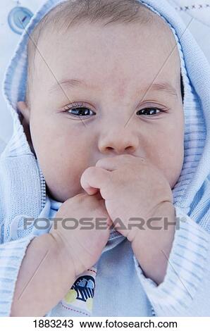 A Baby Boy Sucking On His Fingers View Large Photo Image Stock Image - A Baby Boy Sucking On His Fingers. Fotosearch