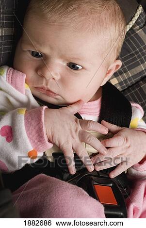 Stock Photograph - A Baby Buckled Into A Car Seat; Millet, Alberta, Canada. Fotosearch