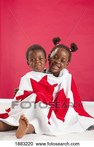 A Boy And Girl Wrapped In A Canadian Flag View Large Photo Image Stock Image - A Boy And Girl Wrapped In A Canadian Flag. Fotosearch