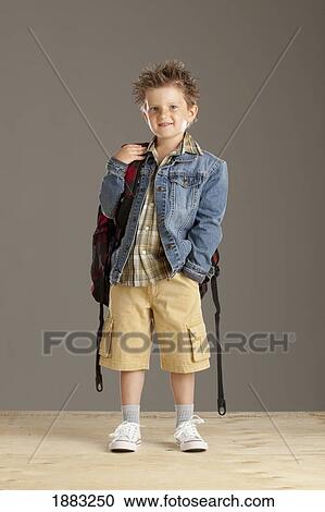 A Boy Carrying A Backpack View Large Photo Image Stock Image - A Boy Carrying A Backpack. Fotosearch