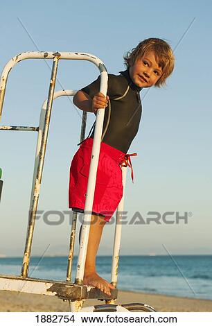 Picture - A Boy On Dos Mares Beach In Front Of Hotel Dos Mares; Tarifa, Cadiz, Andalusia, Spain. Fotosearch