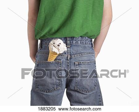 Stock Photography - A Boy With An Ice Cream Cone In His Back Pocket. Fotosearch