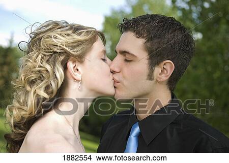A Couple Kissing; Camrose, Alberta, Canada View Large Photo Image Picture - A Couple Kissing; Camrose, Alberta, Canada. Fotosearch