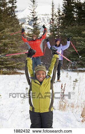 A Family Skiing In The Mountains; Lake Louise, Alberta, Canada View Large Photo Image Stock Image - A Family Skiing In The Mountains; Lake Louise, Alberta, Canada. Fotosearch