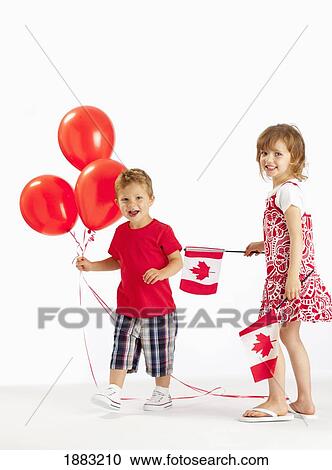 A Girl And Boy Holding Red Balloons And Canada Flags View Large Photo Image Stock Image - A Girl And Boy Holding Red Balloons And Canada Flags. Fotosearch