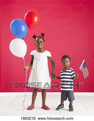 A Girl And Boy Holding Red, White And Blue Balloons And An American Flag View Large Photo Image Stock Photo - A Girl And Boy Holding Red, White And Blue Balloons And An American Flag. Fotosearch