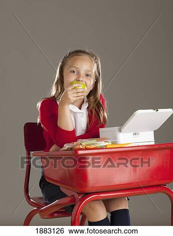 A Girl Eating Her Lunch At Her Desk View Large Photo Image Stock Photograph - A Girl Eating Her Lunch At Her Desk. Fotosearch