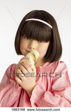 A Girl Holding A Chick View Large Photo Image Stock Photo - A Girl Holding A Chick. Fotosearch