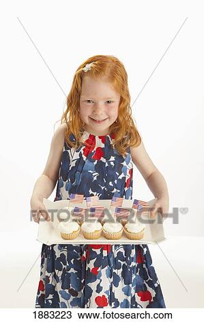 A Girl Holding A Platter Of Cupcakes With American Flags In Them View Large Photo Image Stock Image - A Girl Holding A Platter Of Cupcakes With American Flags In Them. Fotosearch