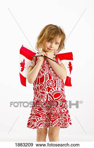 A Girl Holding Two Canada Flags View Large Photo Image Stock Photo - A Girl Holding Two Canada Flags. Fotosearch