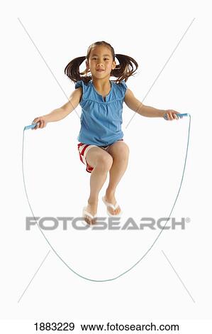 Stock Photo - A Girl Jumping With A Skipping Rope. Fotosearch