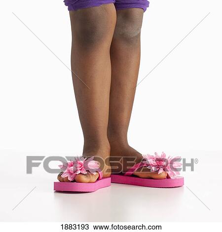 A Girl Wearing Flip Flops With Pink Flowers View Large Photo Image Stock Image - A Girl Wearing Flip Flops With Pink Flowers. Fotosearch