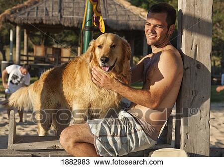 A Man With His Dog; Tarifa, Cadiz, Andalusia, Spain View Large Photo Image Stock Image - A Man With His Dog; Tarifa, Cadiz, Andalusia, Spain. Fotosearch