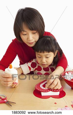 A Mother And Daughter Making A Valentine's Day Craft View Large Photo Image Stock Image - A Mother And Daughter Making A Valentine's Day Craft. Fotosearch