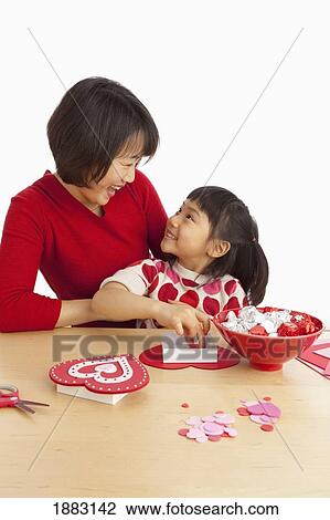 A Mother And Daughter Making Valentine's Day Crafts View Large Photo Image Stock Image - A Mother And Daughter Making Valentine's Day Crafts. Fotosearch