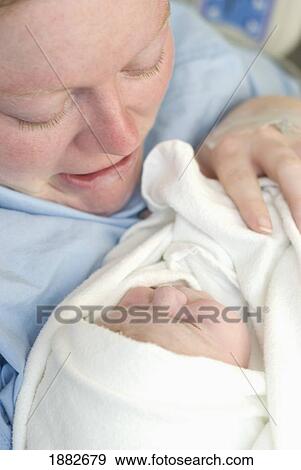 A Mother Crying As She Holds Her Brand New Baby; Millet, Alberta, Canada View Large Photo Image Stock Photo - A Mother Crying As She Holds Her Brand New Baby; Millet, Alberta, Canada. Fotosearch