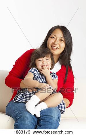 A Mother Holding Her Young Daughter View Large Photo Image Stock Image - A Mother Holding Her Young Daughter. Fotosearch