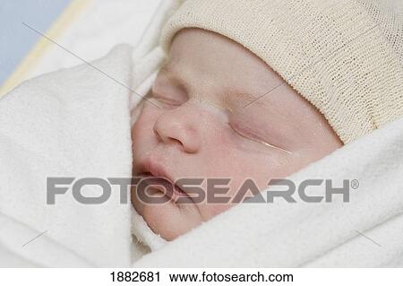 A Newborn Baby Wearing A Cap; Millet, Alberta, Canada View Large Photo Image Stock Image - A Newborn Baby Wearing A Cap; Millet, Alberta, Canada. Fotosearch