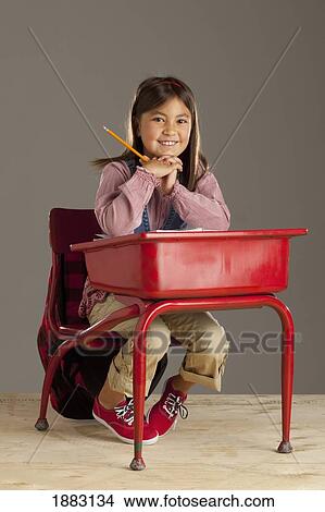 A Student Sitting At Her Desk View Large Photo Image Picture - A Student Sitting At Her Desk. Fotosearch