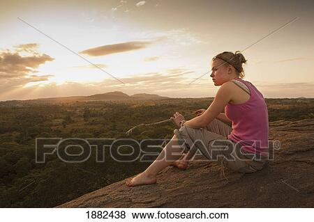 A Young Woman Looking Over The African Landscape; Manica, Mozambique, Africa View Large Photo Image Stock Photo - A Young Woman Looking Over The African Landscape; Manica, Mozambique, Africa. Fotosearch